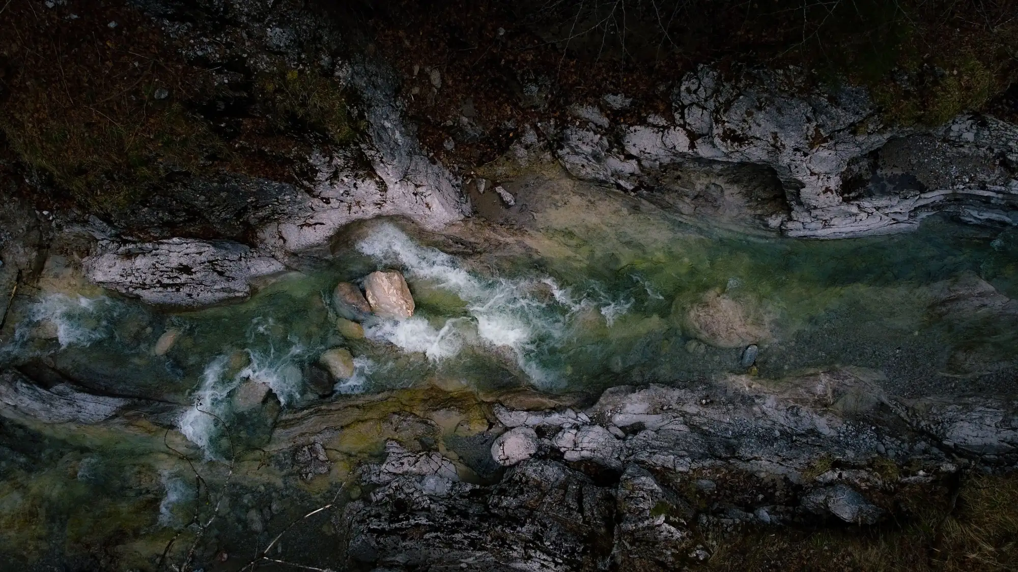 Aerial view of a river flowing through a limestone gorge