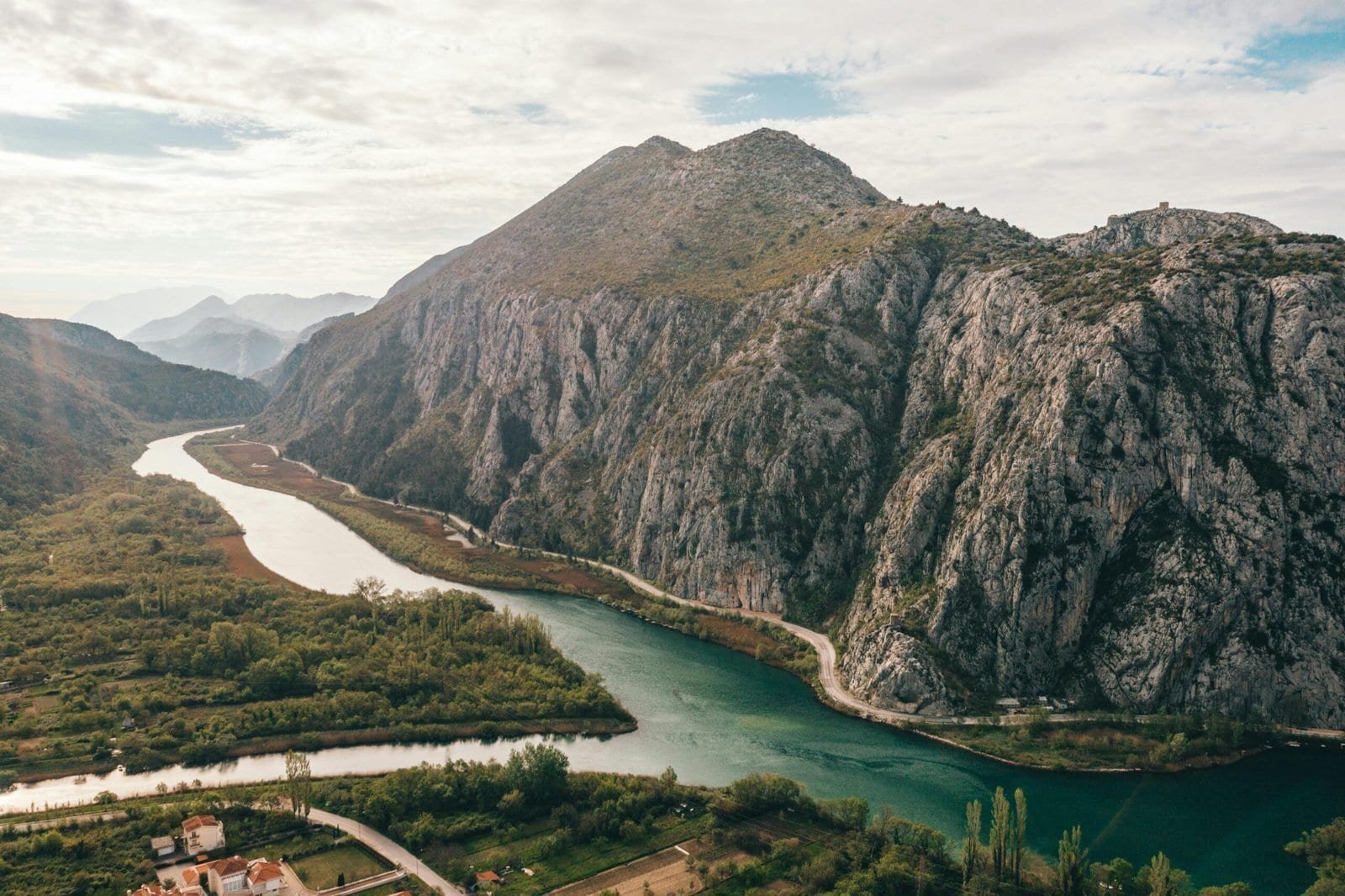 Cetina River flowing between limestone cliffs into the Adriatic Sea at Omiš, Croatia