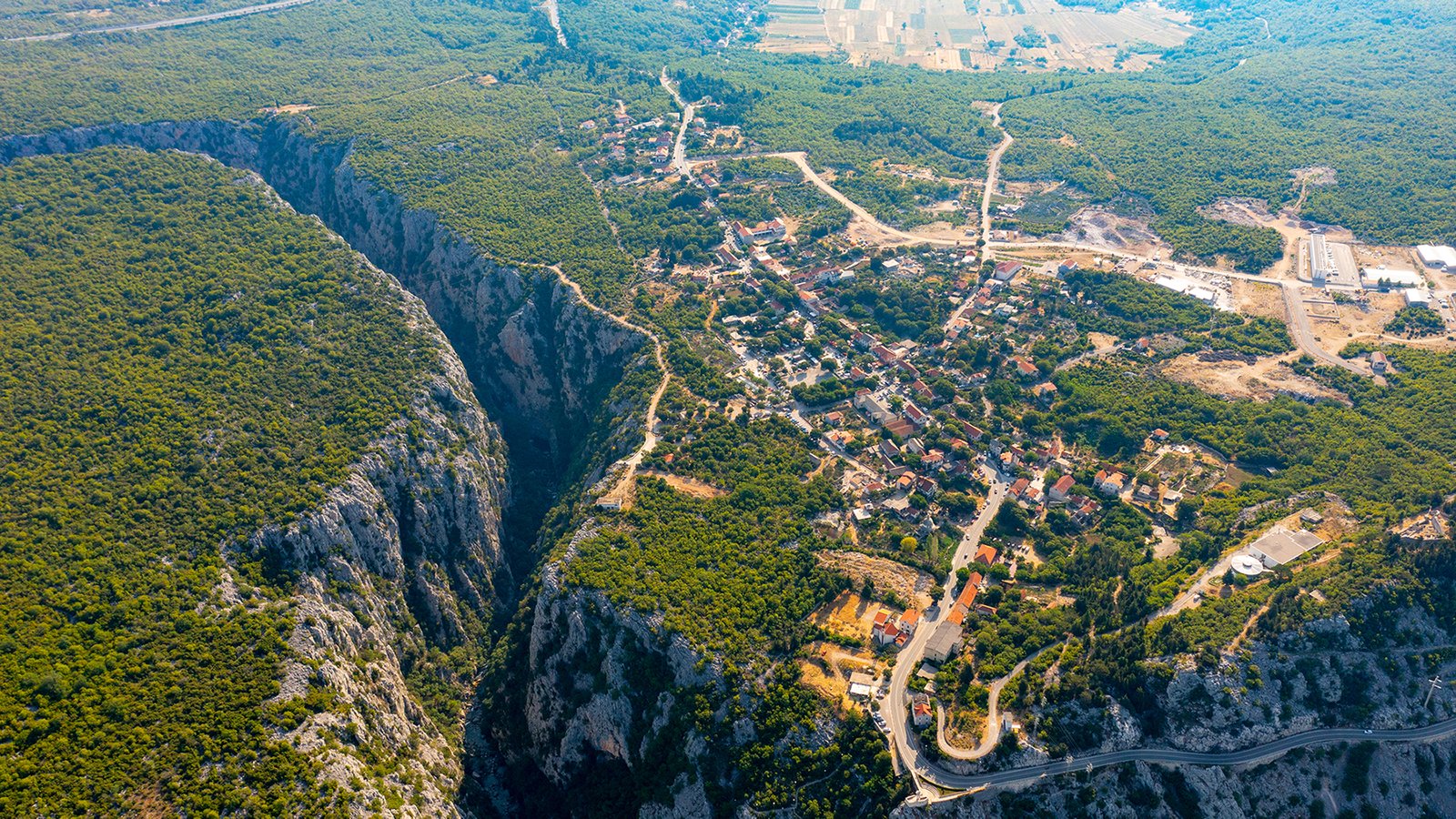 Canyoning in the Cetina canyon at Zadvarje, swimming below a waterfall